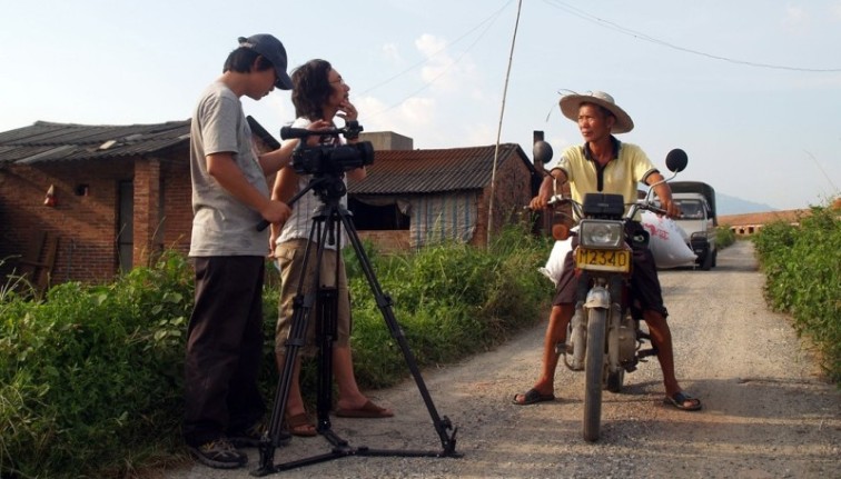Director Jian Yi and Cinematographer Pan Kewu filming in Guangdong